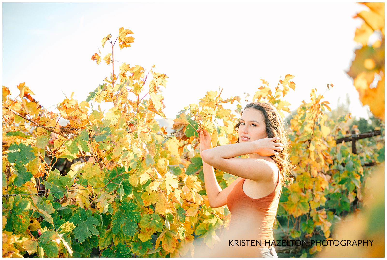 Ravenswood Livermore Photos: a girl in an orange tank top stands in a vineyard in the fall