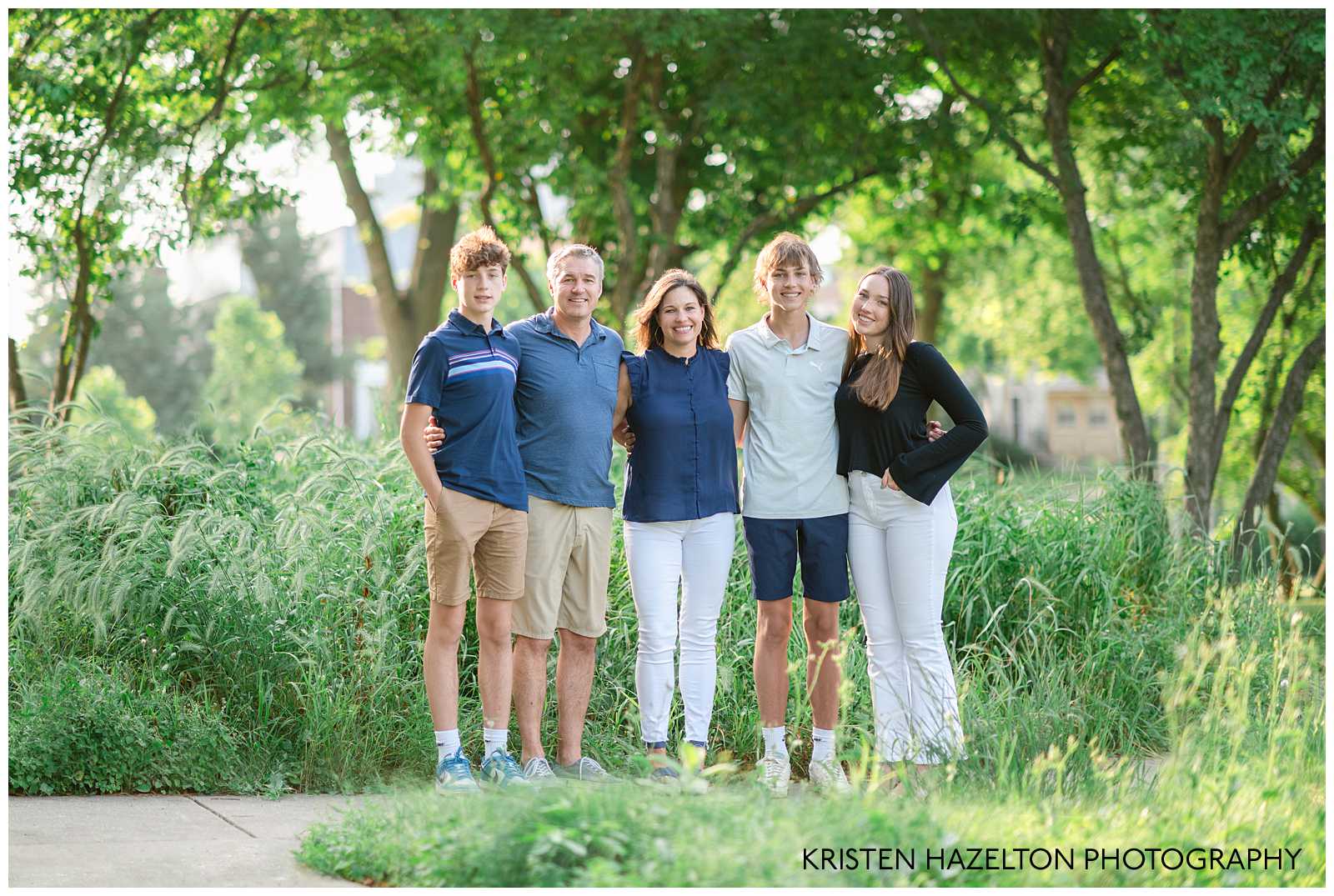 Family of five with three teenage children at photoshoot highlighting family photos with teens by Chicago photographer Kristen Hazelton.