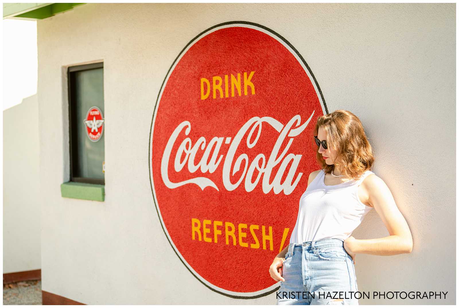 Senior portraits next to a Coca-Cola logo with a retro vibe by San Jose CA Senior Photographer Kristen Hazelton