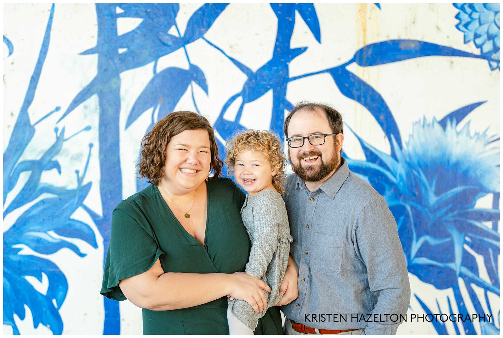 Family photos at Ping Tom Memorial Park in Chicago with blue and white mural in the background