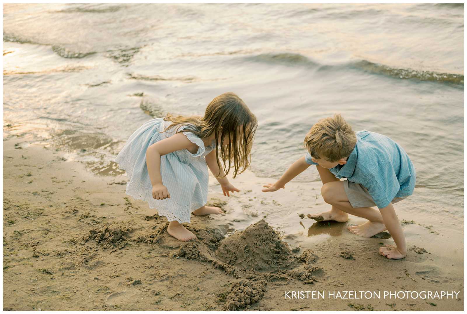 Brother and sister making a sand castle during their beach family photos by photographer Kristen Hazelton.