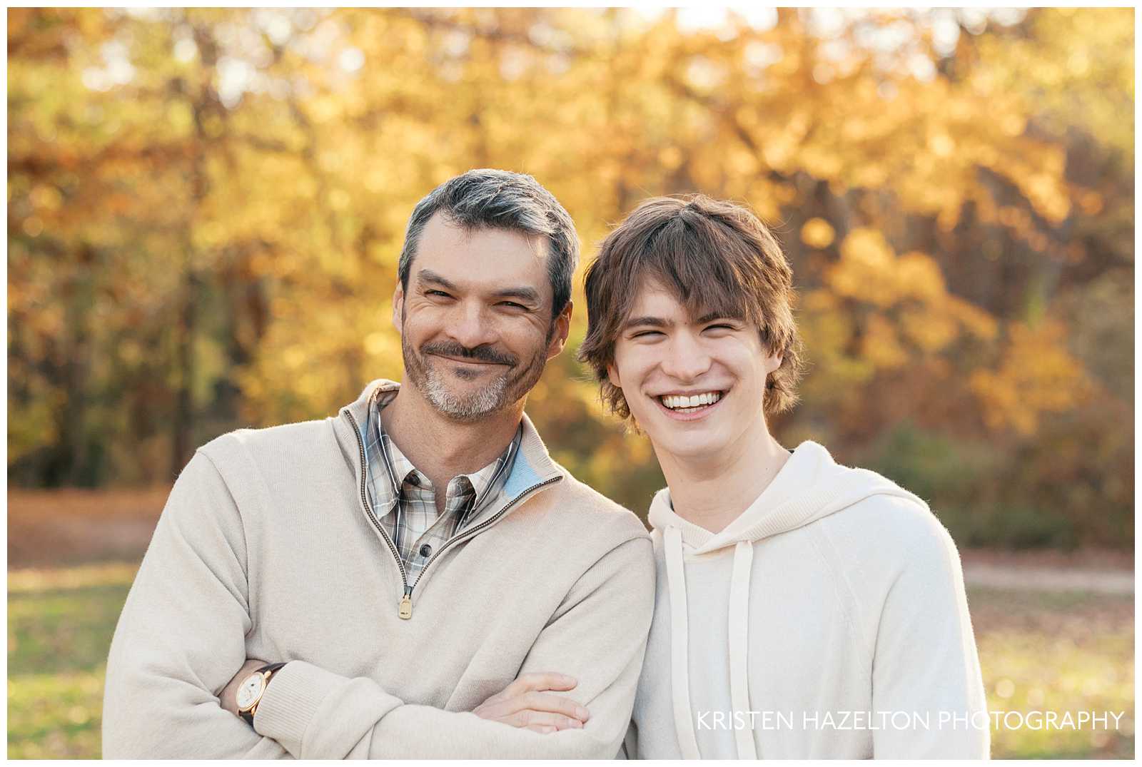 Smiling father and teenage son for their fall family portraits by Evanston photographer Kristen Hazelton. 