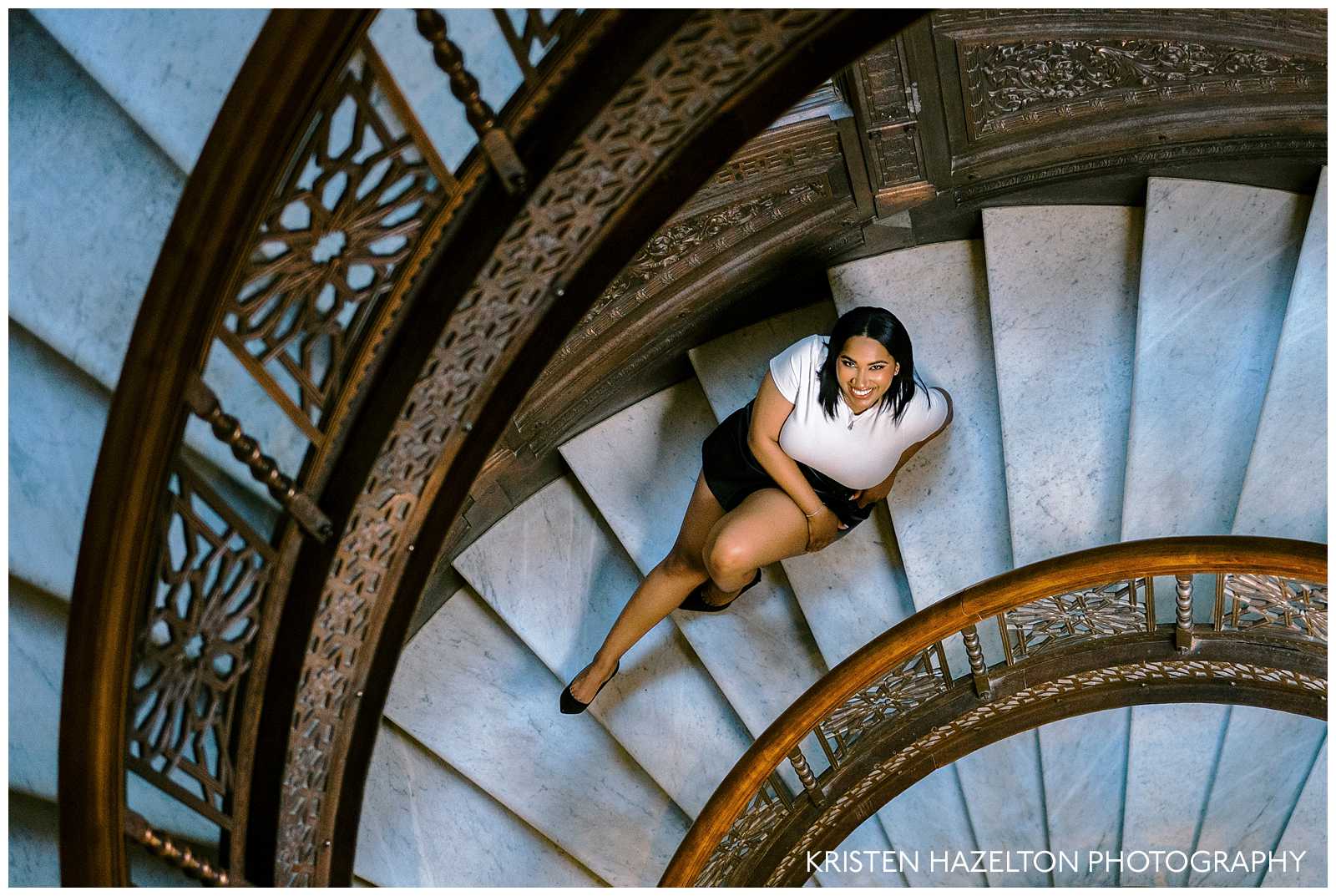 Woman seated on steps for her Rookery Building photos