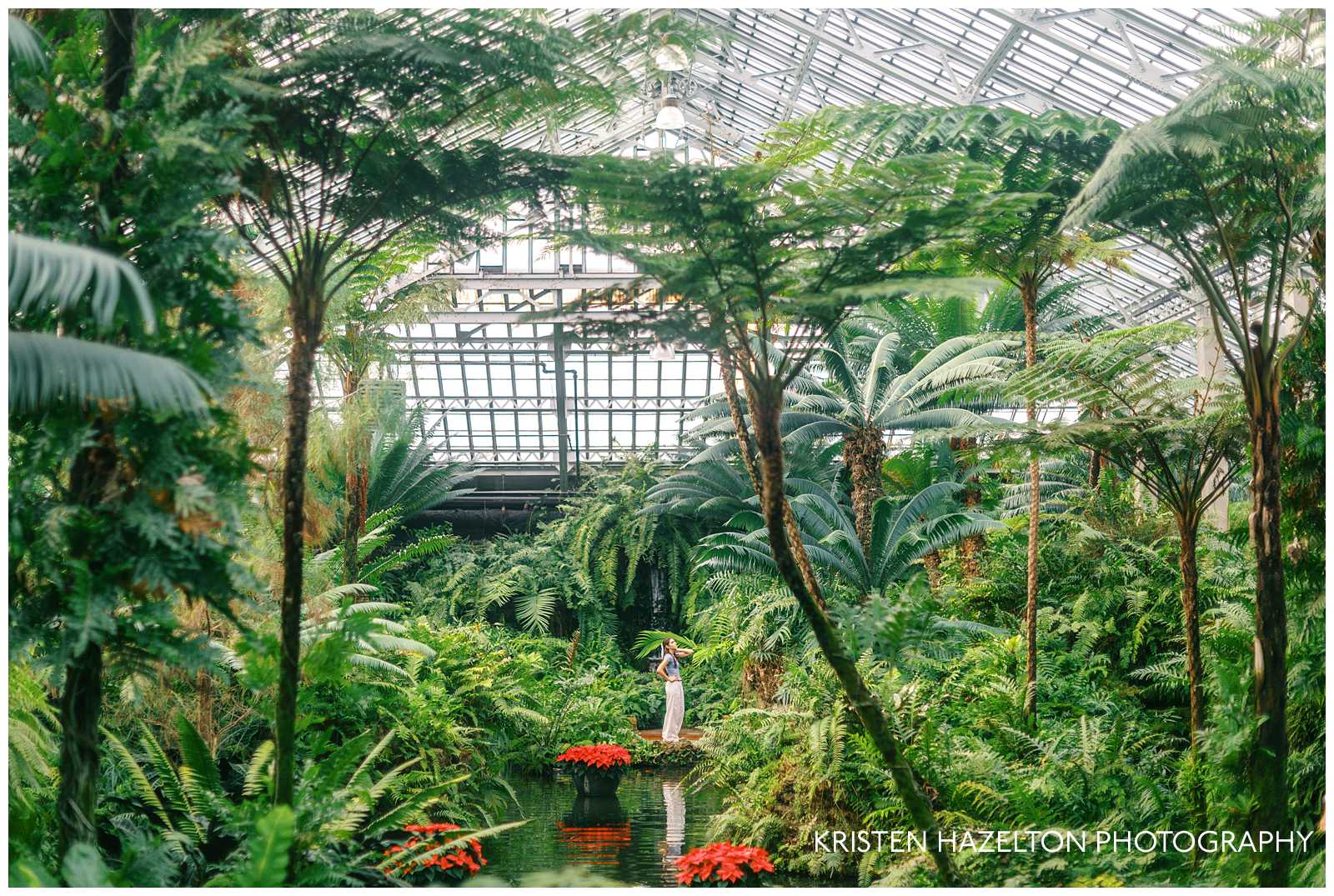 Girl in white pants standing in the middle of a greenhouse filled with ferns; Garfield Park Conservatory photos