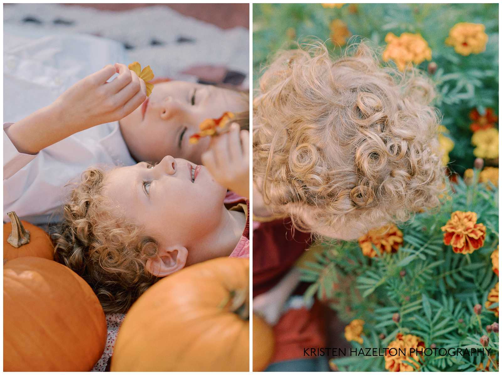 Little girl and boy sitting on a quilt for backyard for fall photos with pumpkins acquired from a pumpkin patch by Chicago.