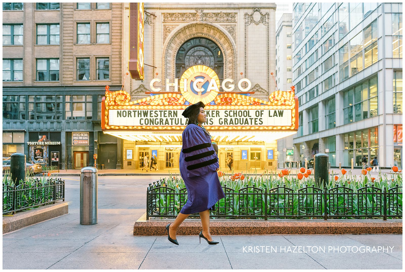 Chicago Theatre photos: a graduate walks down the sidewalk in front of the theater with the spring tulips