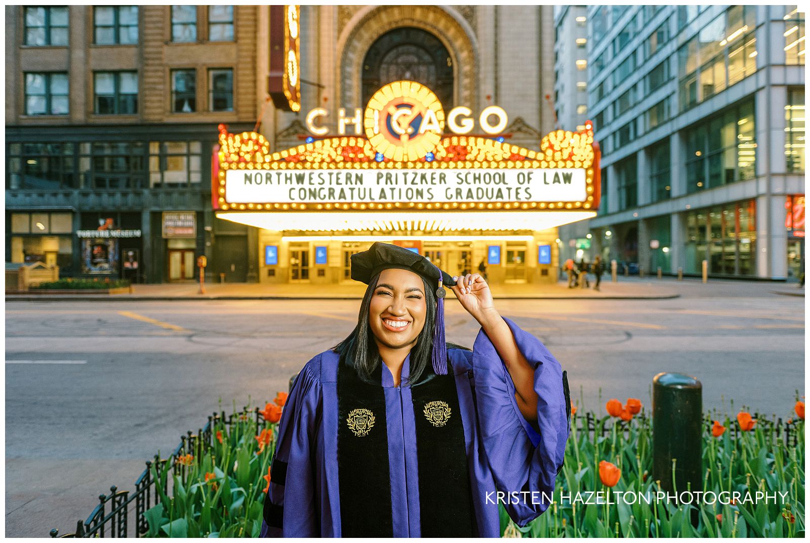 Northwestern graduation portraits at the Chicago Theatre; a graduate in law school cap and gown smiles