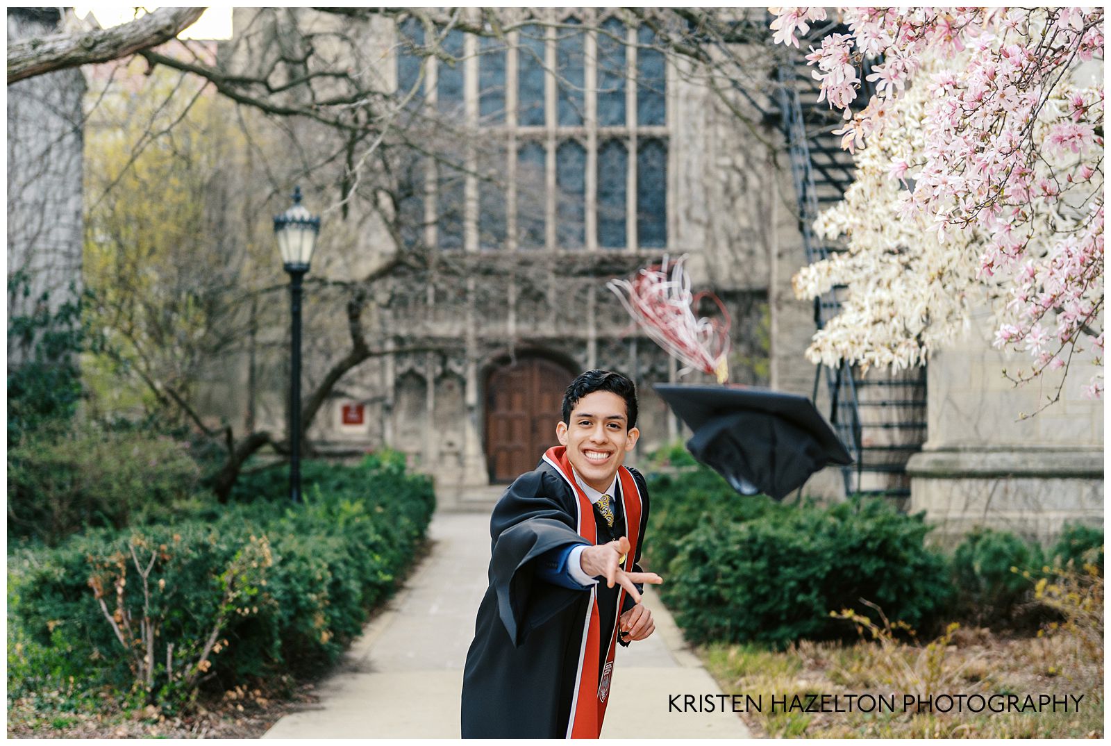 University graduate throwing his cap