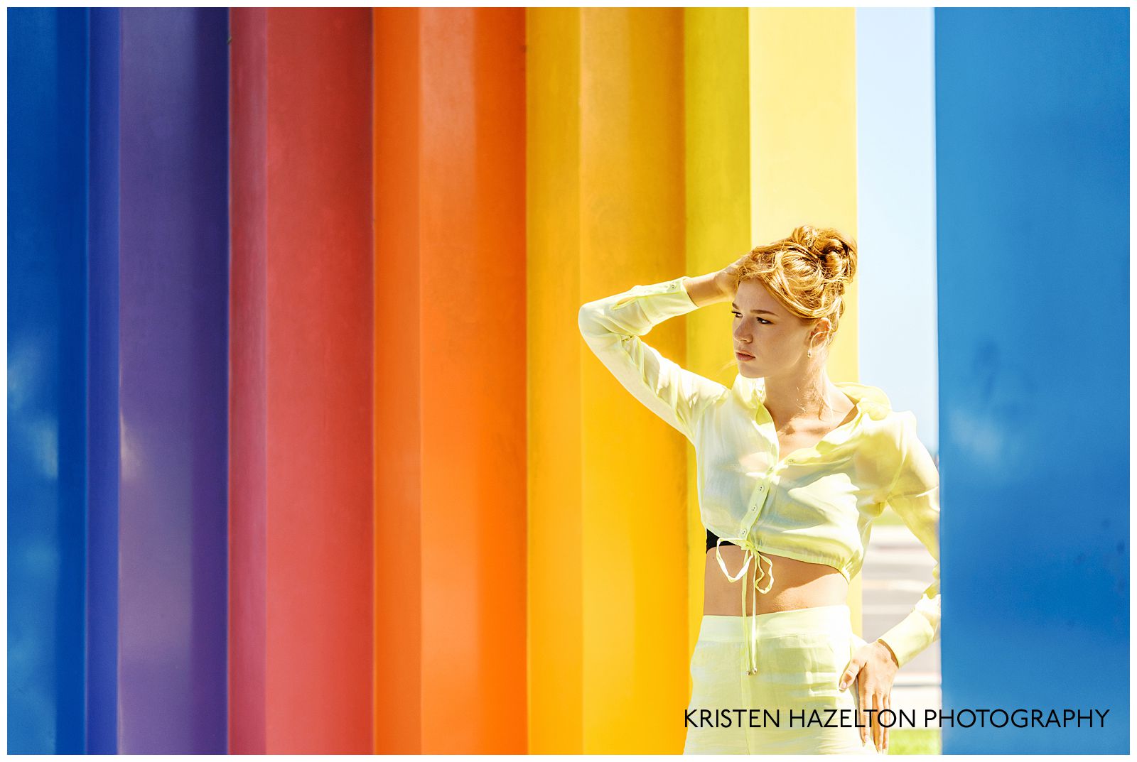 Redheaded model wearing a butter yellow linen outfit for her Chromatic gate photos along the Santa Barbara, CA beachfront