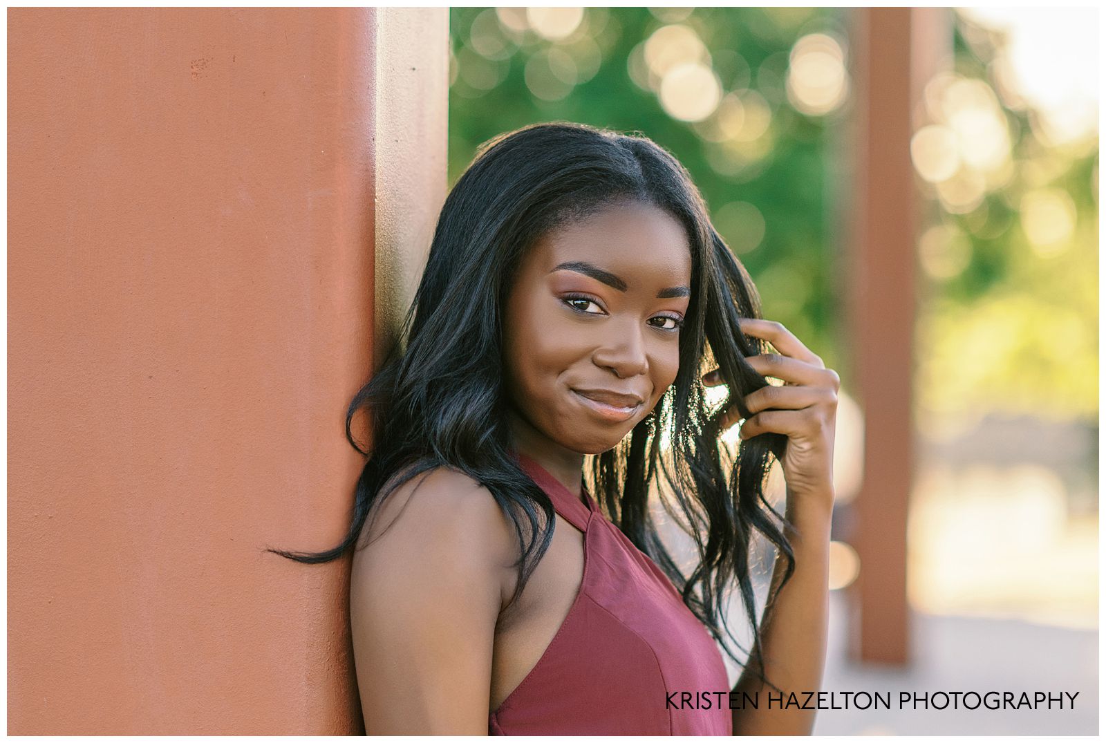 Closeup image of an eighth grade graduate playing with her hair